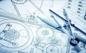 A picture of a blueprint with tools on it.