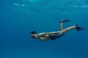 Decompression Sickness - man-freediving-with-flippers-underwater