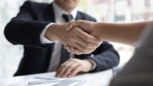 Professional handshake at a business meeting.